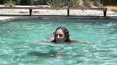 Layla London plays in the pool