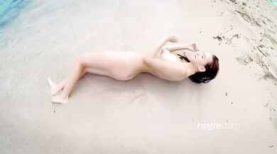 Alisa Amore nude on the beach and in the sea