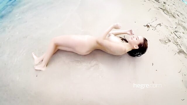 Alisa Amore nude on the beach and in the sea
