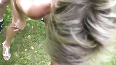 Sexual mature blonde is fucking outdoors with others