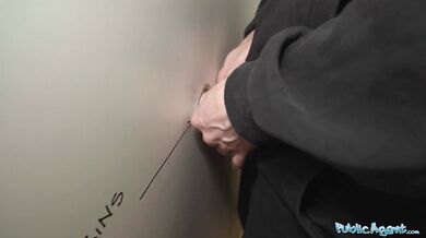 Nervous looking woman sucks and fucks cock through a gloryhole