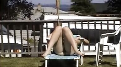 Carla Spreads Her Legs And Flashes Her Pussy While Sunbathing In The Yard