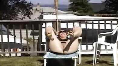 Carla Spreads Her Legs And Flashes Her Pussy While Sunbathing In The Yard