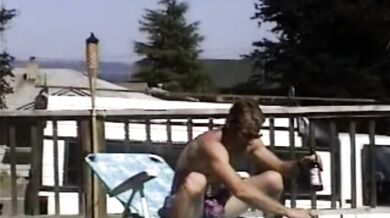 Carla Spreads Her Legs And Flashes Her Pussy While Sunbathing In The Yard