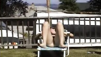 Carla Spreads Her Legs And Flashes Her Pussy While Sunbathing In The Yard