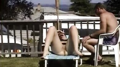 Carla Spreads Her Legs And Flashes Her Pussy While Sunbathing In The Yard