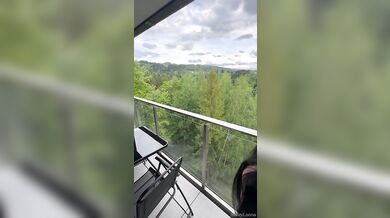 Mini Loona performs a balcony blowjob and then gets ploughed while wearing black lingerie with a scenic view