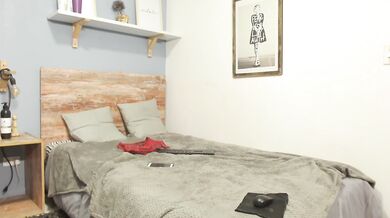 Masturbating with a dildo against the wall