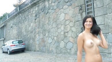Katie Oliver appears naked on the streets of Prague