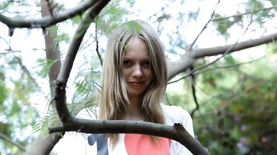 Teen plays with her pussy in tree