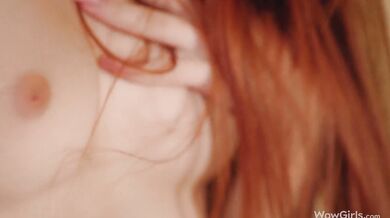 Horny redhead girl Megan Murkovski masturbating in front of the camera