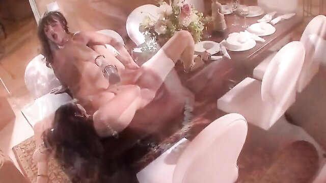 Gianna Michaels and Sadie West fuck with a double-sided dildo