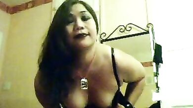 Asian in PVC shows shaved pussy for licking