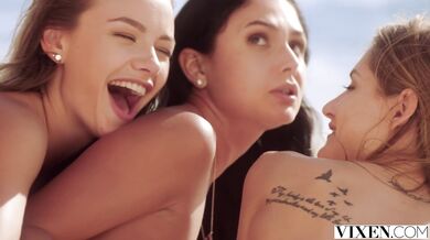 Three pussies fucking in foursome on the beach